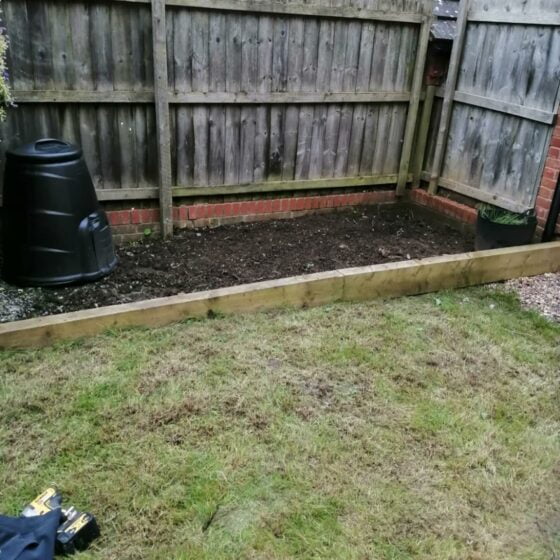 Freshly weeded garden flower beds.